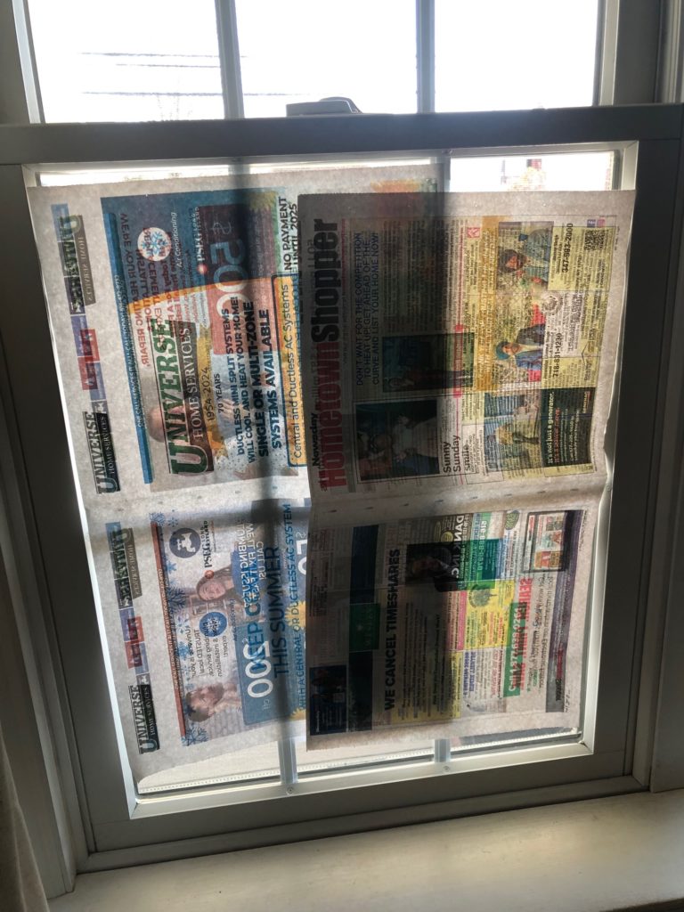 Newspaper on window